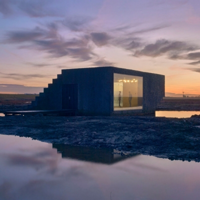 Textured concrete gives rocky appearance to office in a nature reserve by Rink Tilanus